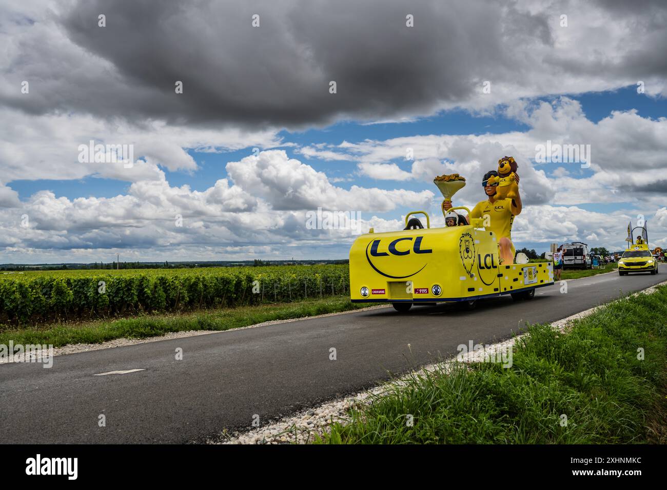 2024 Tour de France race publicity convoy with Crédit Lyonnais vehicle heading to Dijon stage 6 finish. Stock Photo