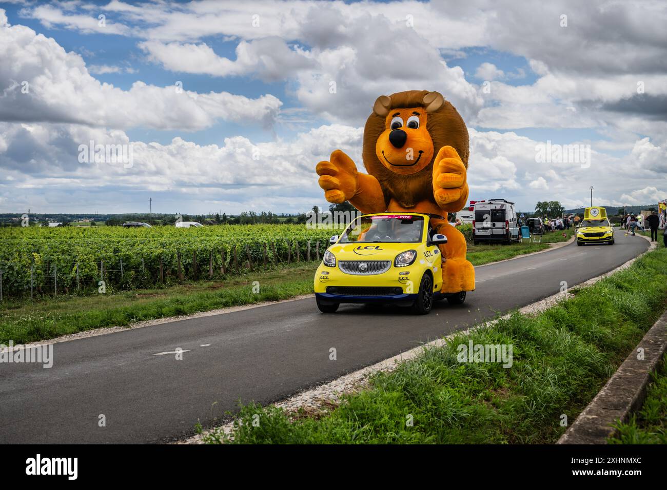 2024 Tour de France race publicity convoy with Crédit Lyonnais vehicle heading to Dijon stage 6 finish. Stock Photo