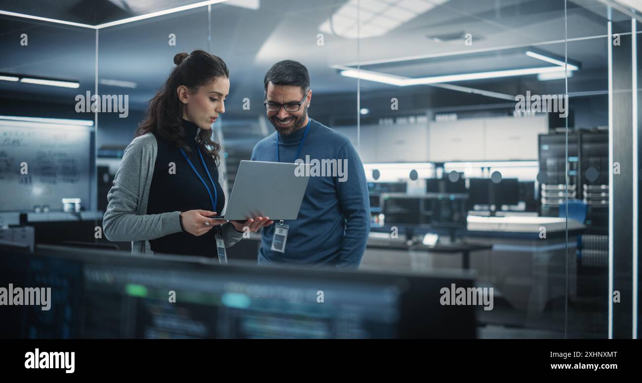 Communication Between Computer Engineer Multiethnic software engineers chatting workplace hi-res stock ...