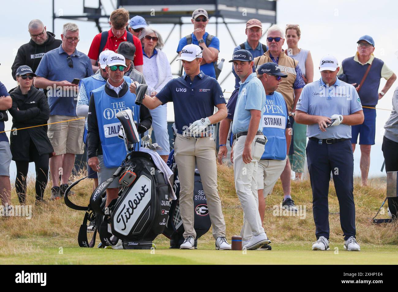 Troon, UK. 15th July, 2024. WILL ZALATORIS, an American Professional Golfer, SEPP STRAKA, an Austrian Professional Golfer, and JT POSTON, an American Professional golfer, tee off at the 16th on practice day Monday. Credit: Findlay/Alamy Live News Stock Photo