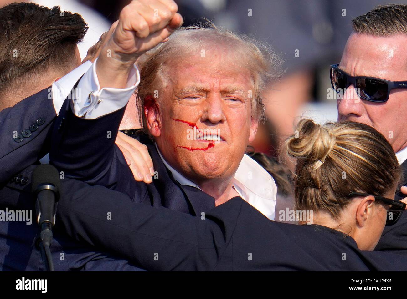 FILE - Republican presidential candidate former President Donald Trump reacts following an assassination attempt at a campaign event in Butler, Pa., on Saturday, July 13, 2024. Trump Media surged in the first day of trading, Monday, July 15, following the assassination attempt. (AP Photo/Gene J. Puskar, File) Stock Photo