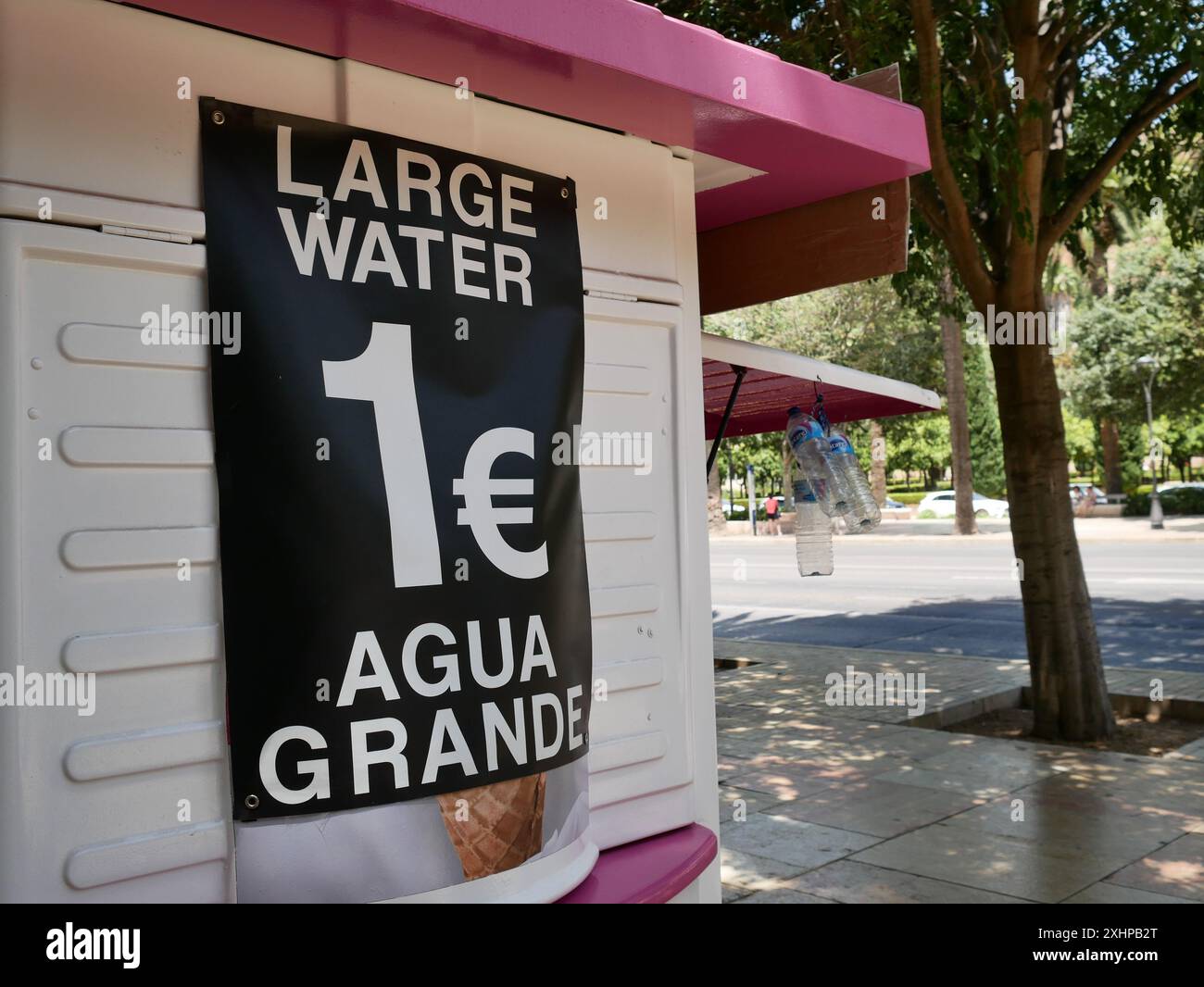 Water seller selling bottled drinking water, Malaga, Andalusia, Spain Stock Photo