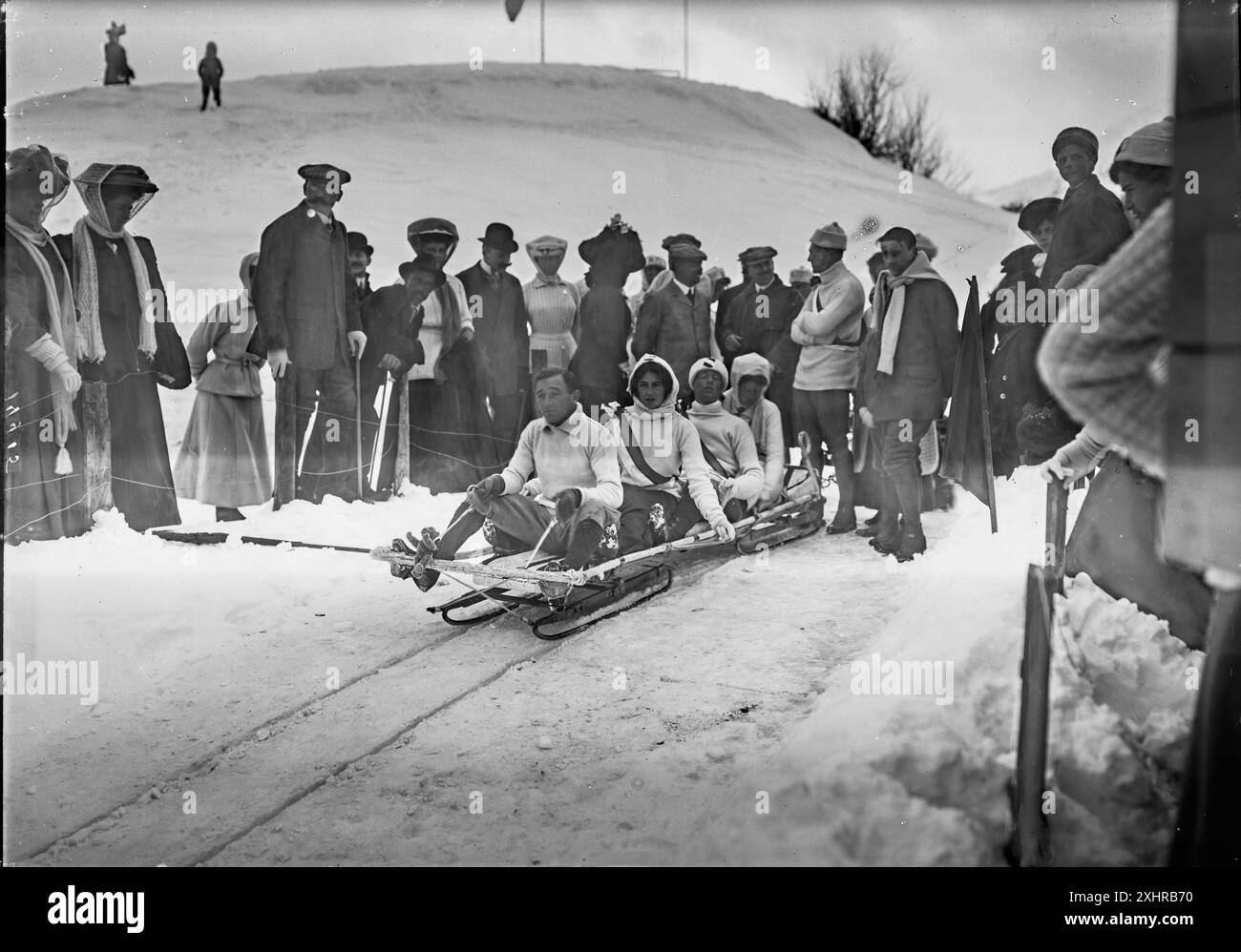 People at the start of the St. Moritz bobsleigh track, bobsleigh team preparing for the start in the Swiss Alps. Vintage Swiss Historical Mountaineering Photography,  1908, Photo Credit: Arthur Wehrli Stock Photo