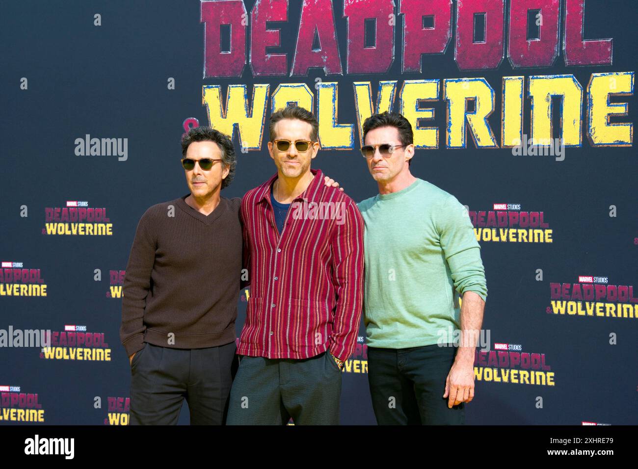 Shawn Levy (director), the actors Ryan Reynolds, Hugh Jackman, DEADPOOL & WOLVERINE (cinema release: 24.07.2024), red-yellow carpet at the fan event Stock Photo