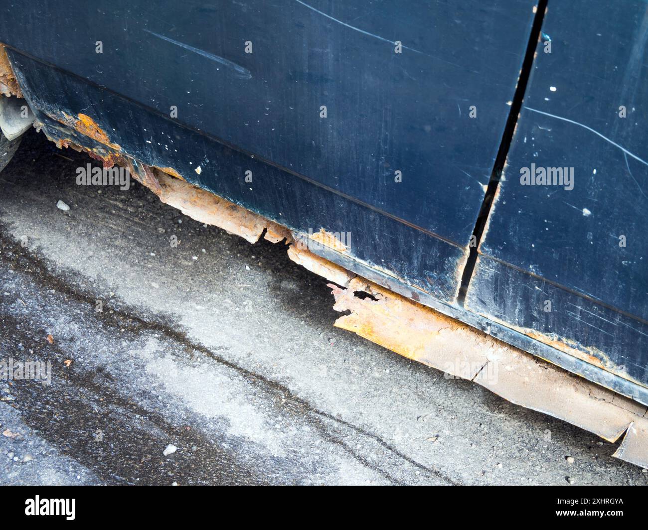 Car sills completely destroyed by corrosion Stock Photo