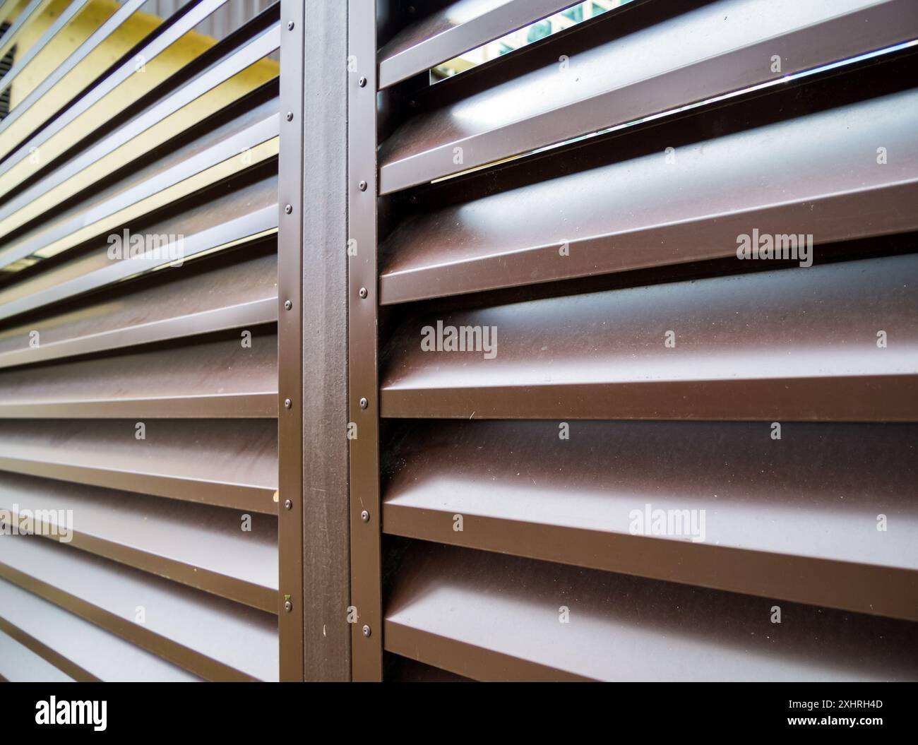 Part of a metal horizontal picket fence Stock Photo