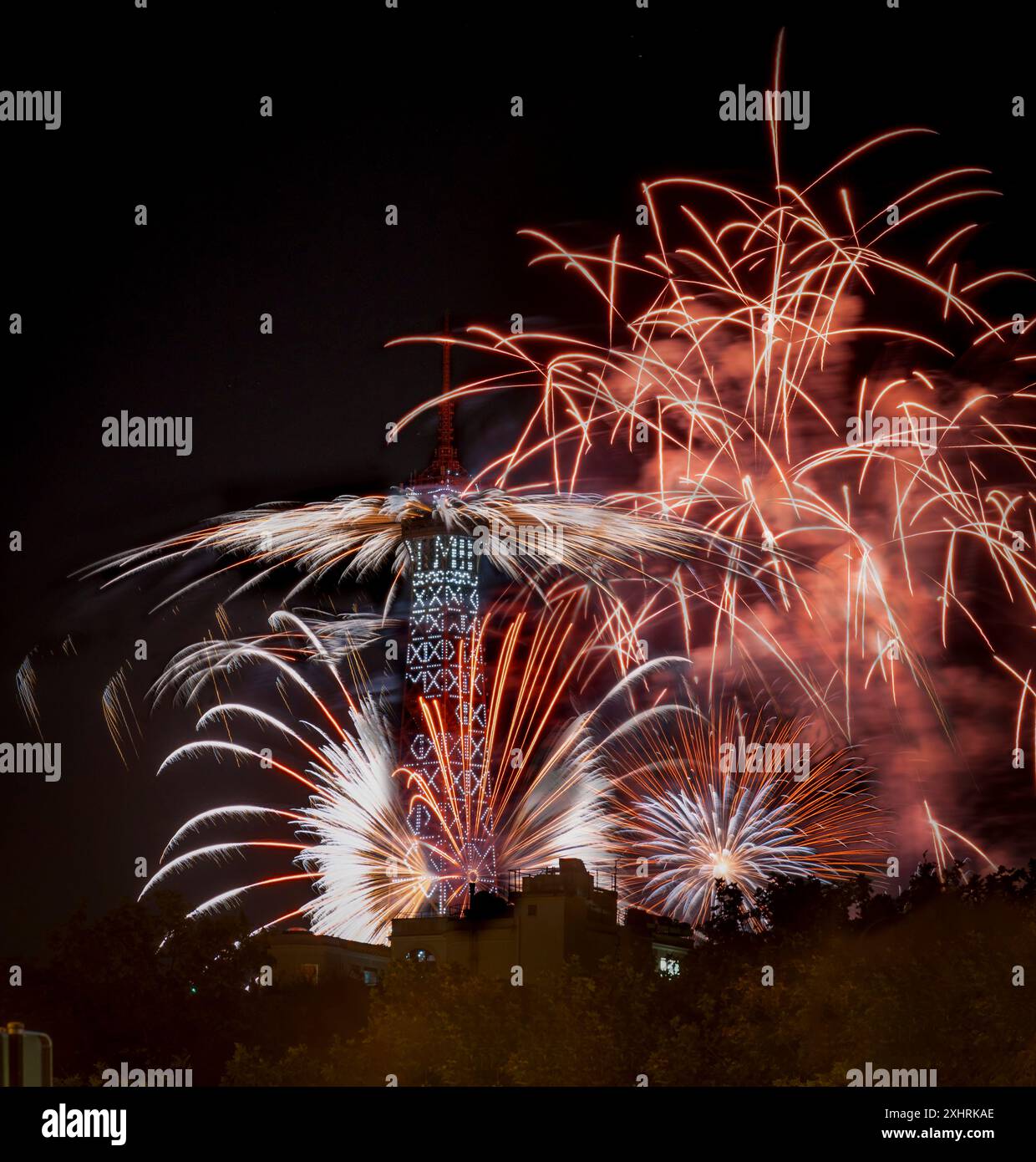 Paris, France - 07 14 2024: July 14 fireworks fired from The Eiffel Tower in Paris Stock Photo