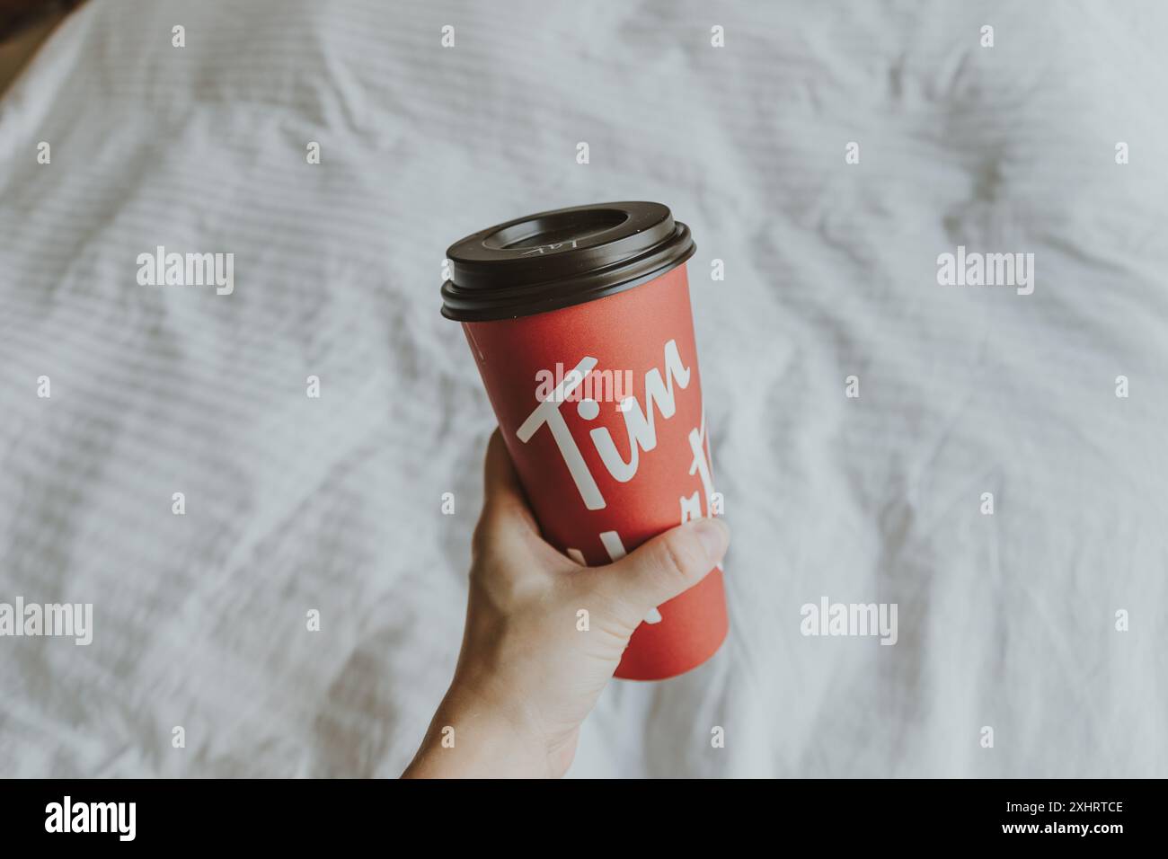 DUBAI, UAE - 9 AUGUST 2020: Tim Hortons takeaway red coffee cup with ...