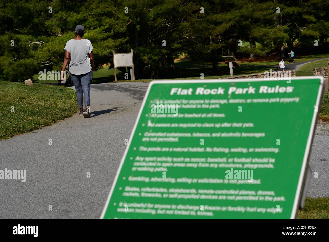 African woman walks in park hi-res stock photography and images - Alamy