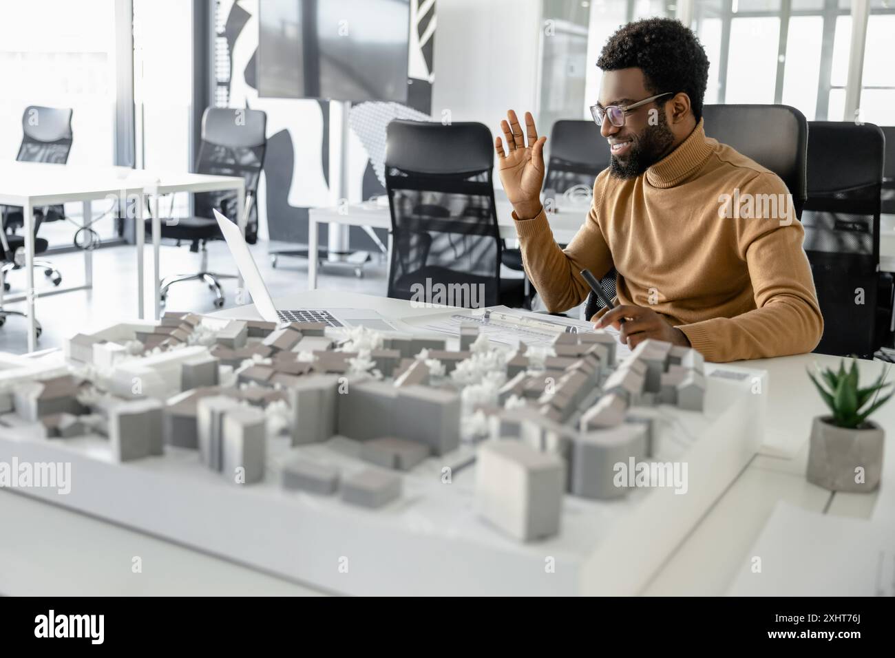 Confident man architect planning new developments on video call in the ...