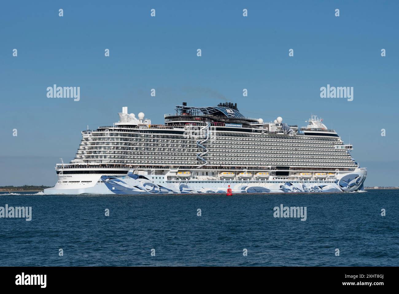 Southampton Water southern England, UK. 14.07.2024. Cruise ship Norwegian Prima underway on Southampton Water heading out to sea. Stock Photo
