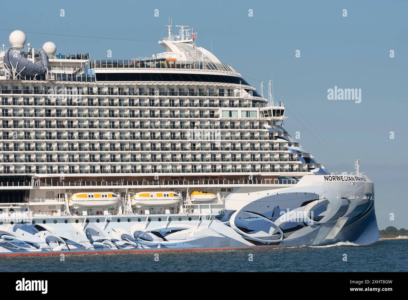 Southampton Water southern England, UK. 14.07.2024. Cruise ship Norwegian Prima underway on Southampton Water heading out to sea. Stock Photo