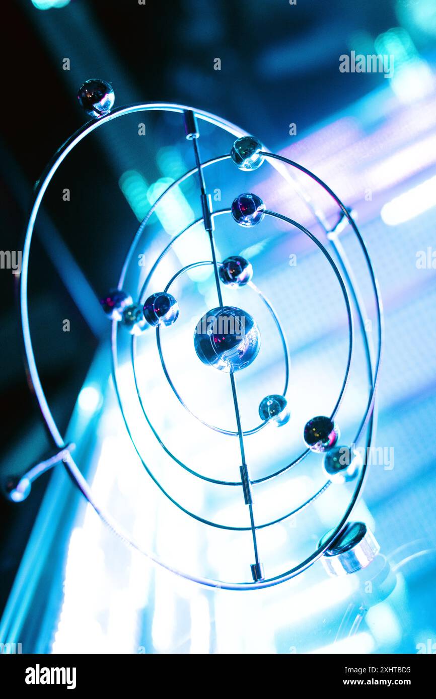Metal Solar System Model in Neon Lighting Stock Photo
