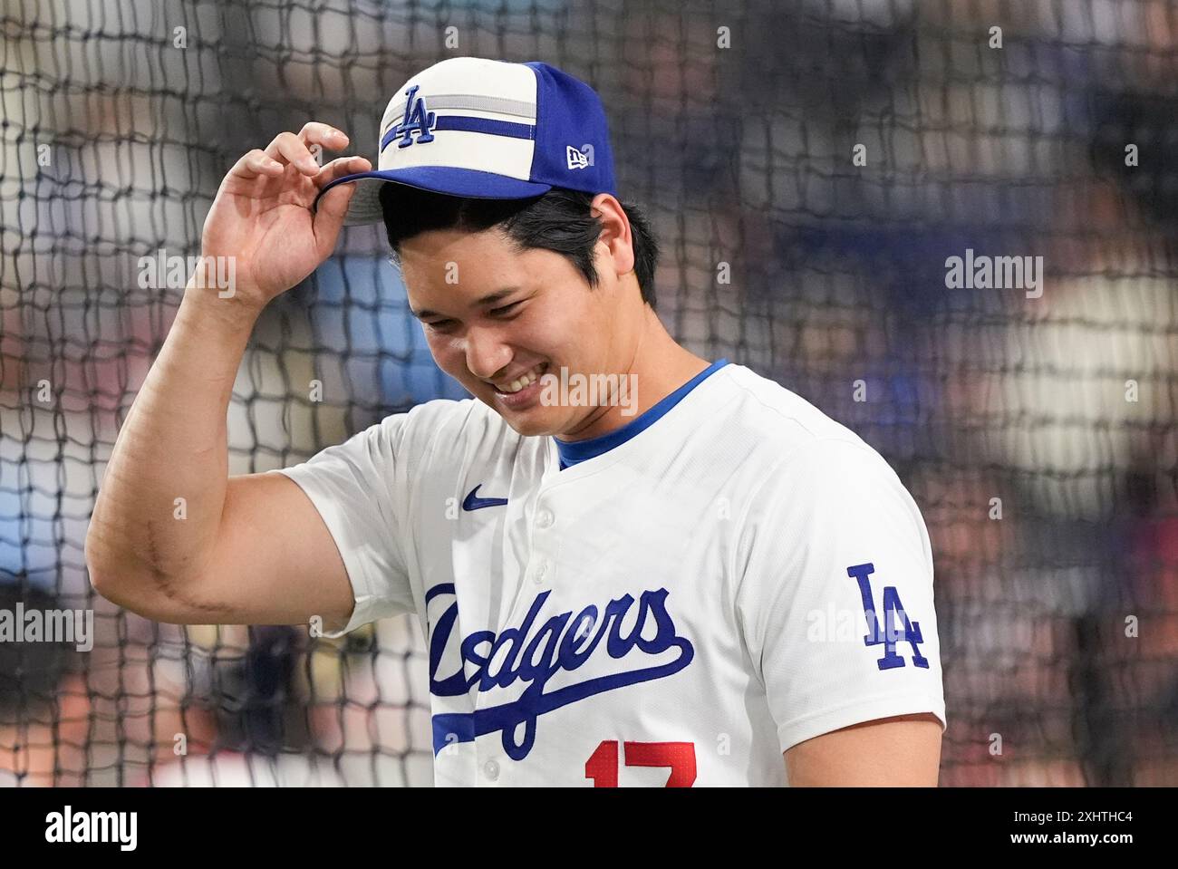 National League's Shohei Ohtani, of the Los Angeles Dodgers, smiles