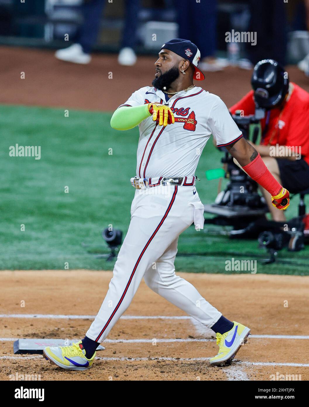 Atlanta Braves designated hitter Marcell Ozuna (20) follows through