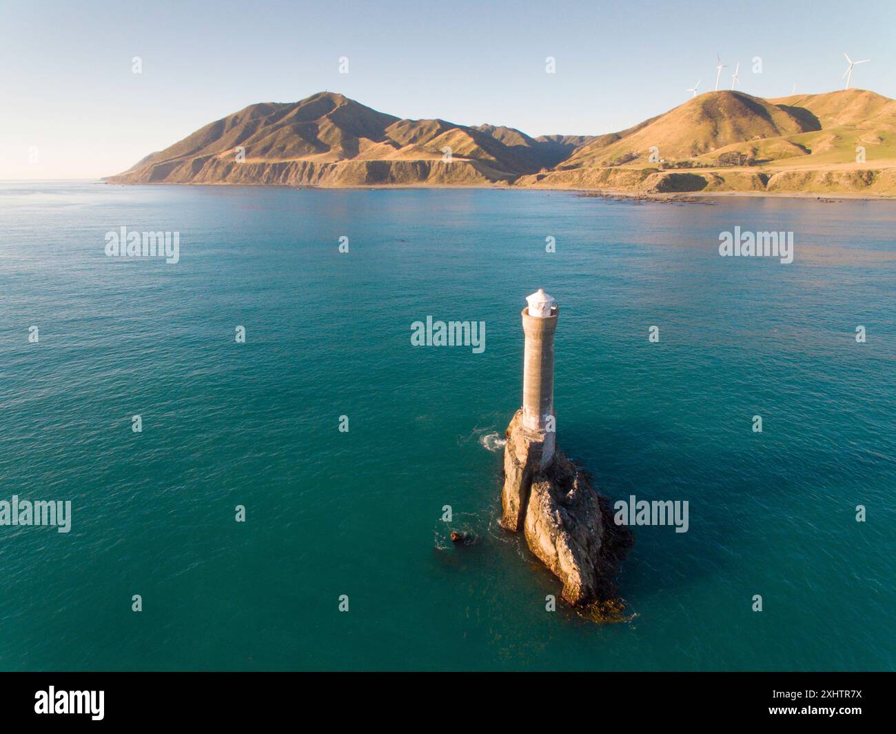 Aerial view of Karori rock lighthouse off the Wellington south coast, New Zealand Stock Photo