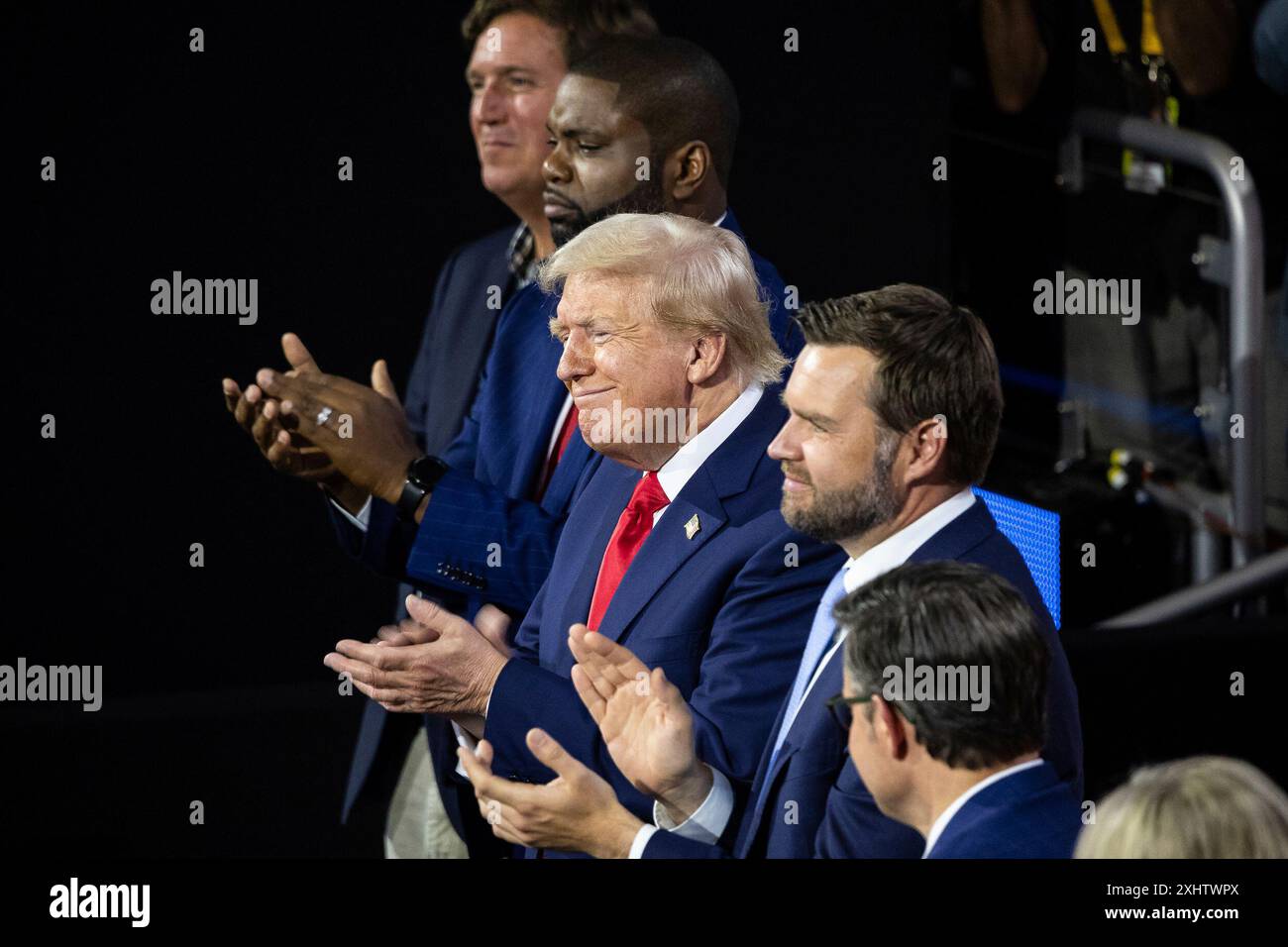 Former President Donald Trump applauds next to his vice presidential ...