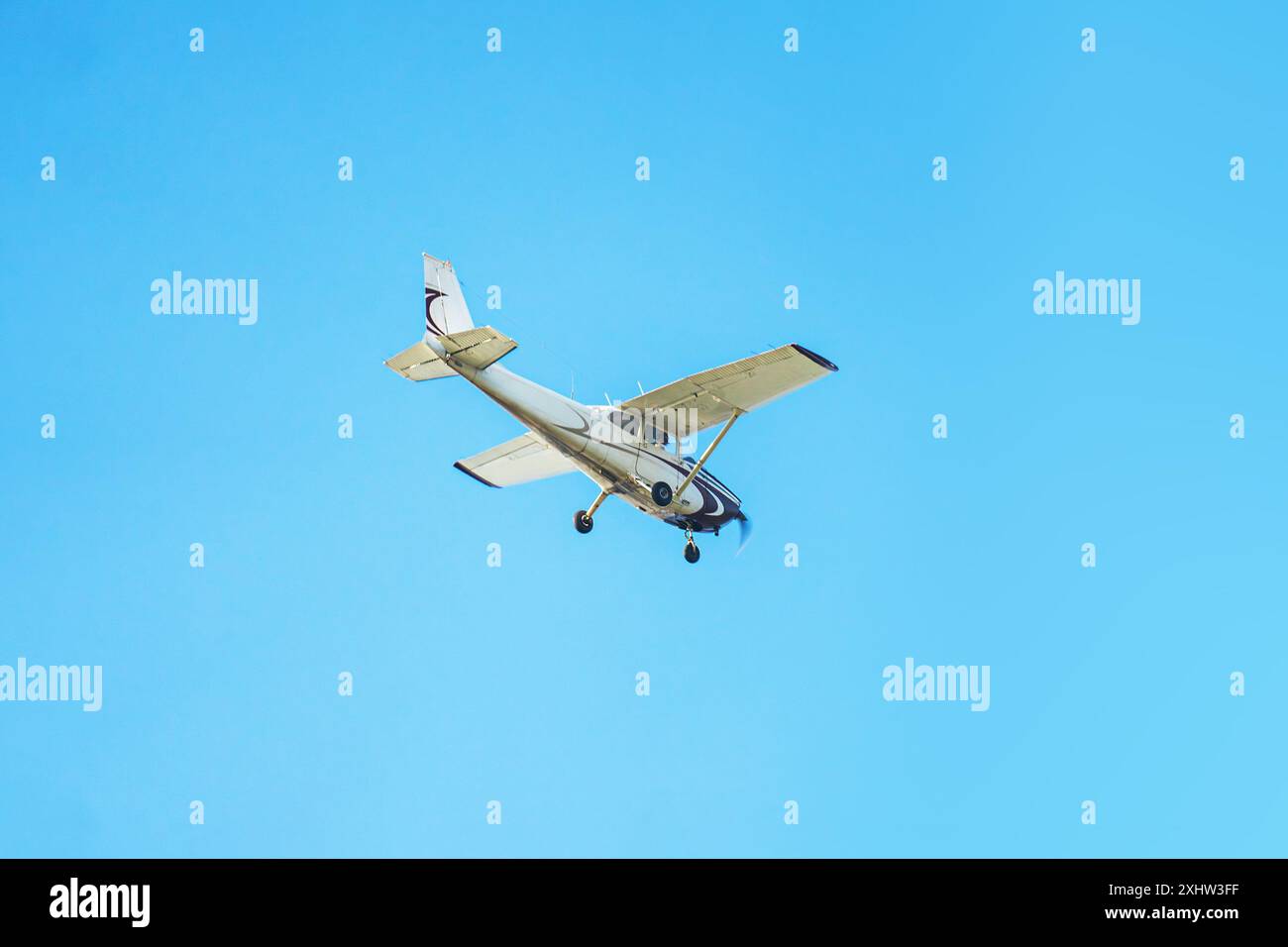Small airplane against blue sky Stock Photo