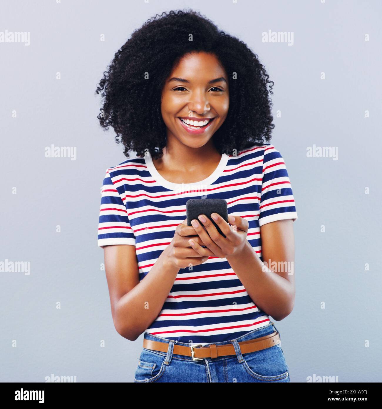 Studio, portrait and happy woman with mobile for chat, laugh and online ...