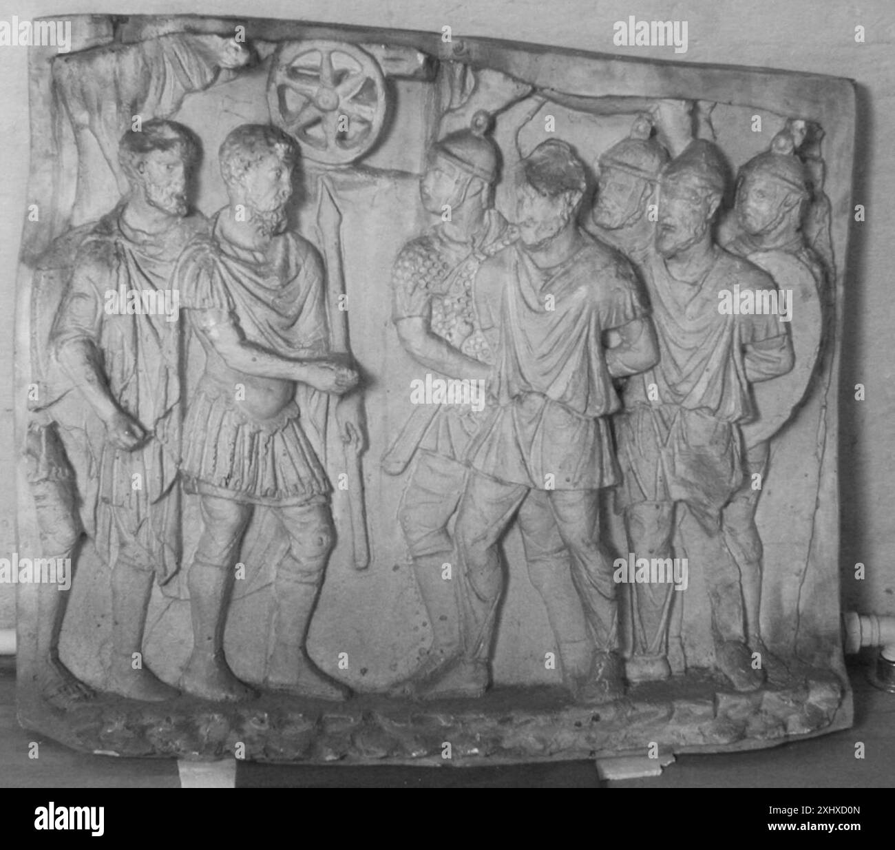 This relief depicts captured barbarians wearing conical headgear led ...