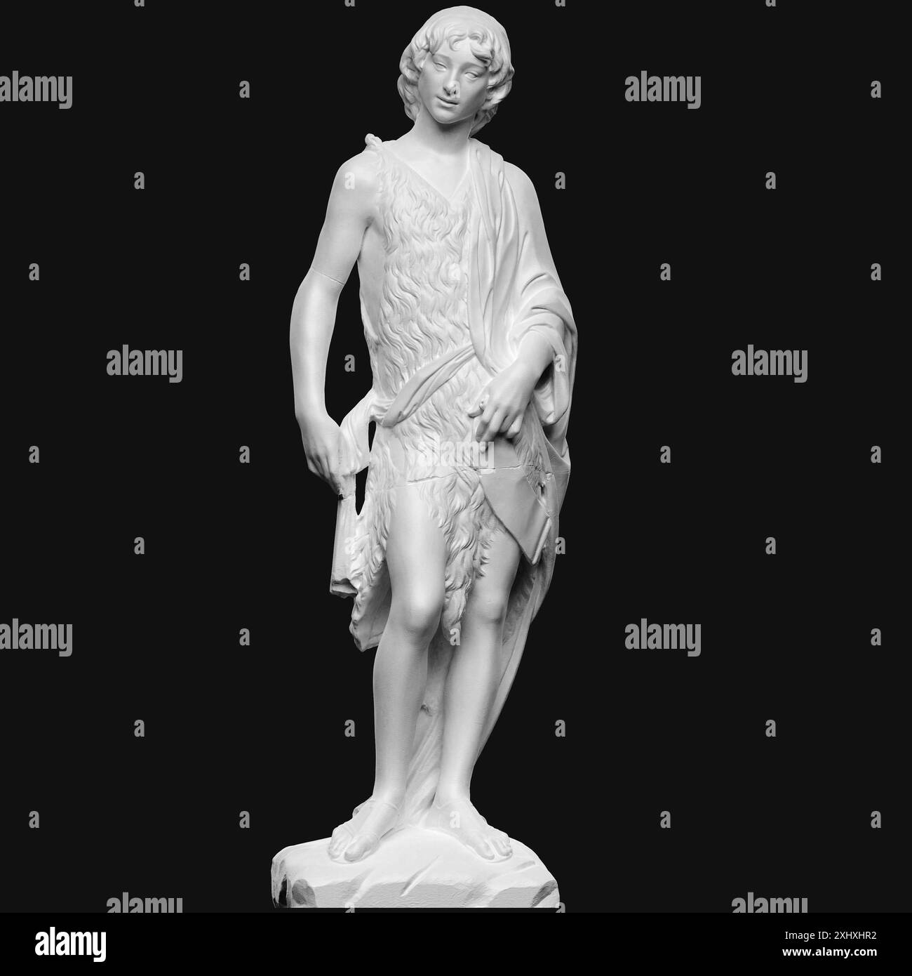 A statue depicting John the Baptist as a boy, showing youthful features ...