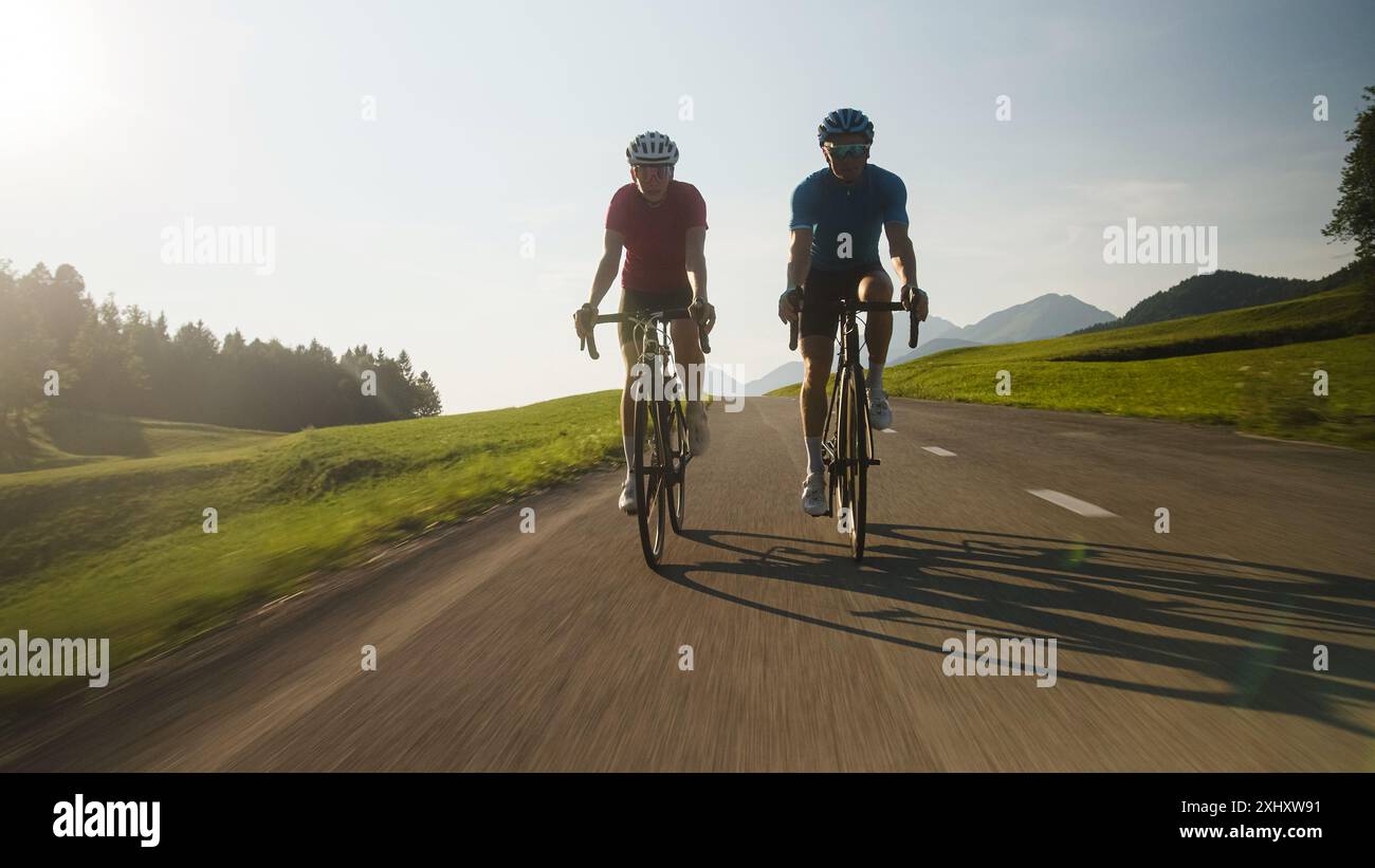 Professional Ragers Two professional cyclist racers, male and female during training on a ...