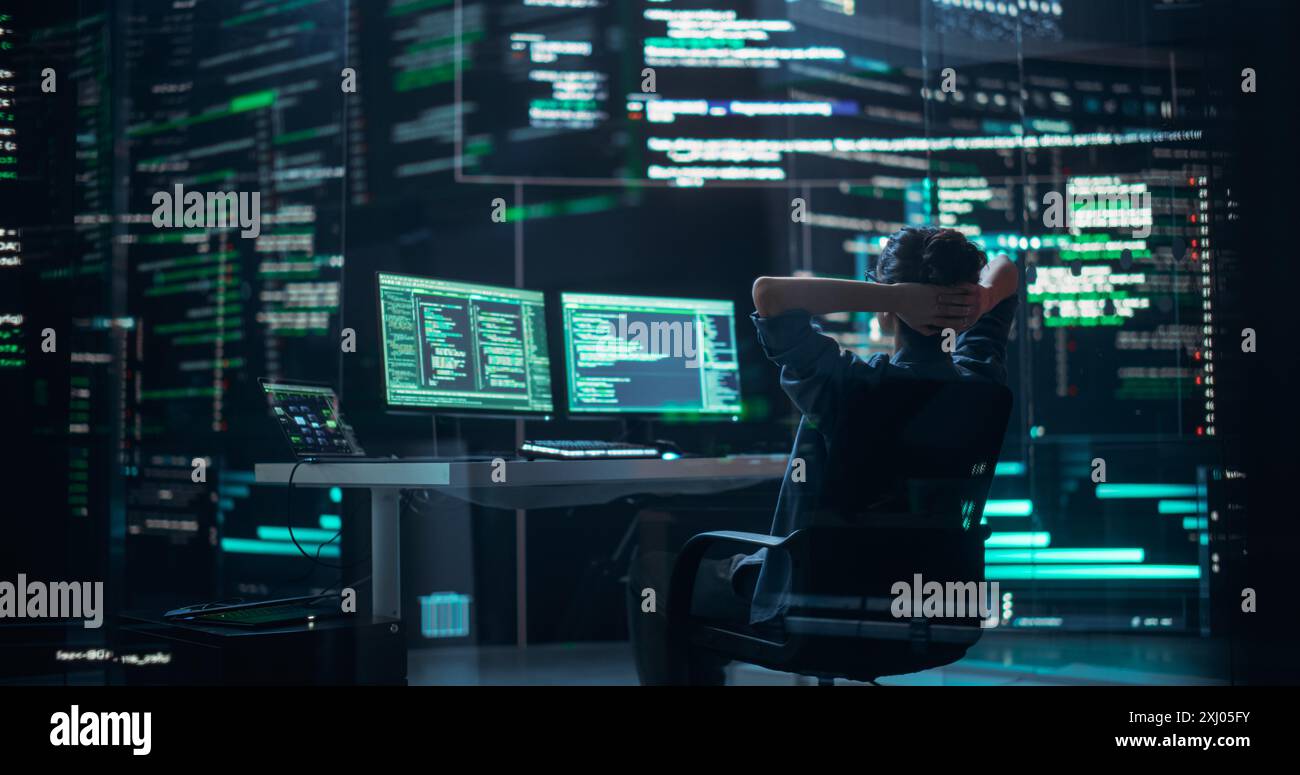 Female Developer Happily Resting After Successfully Typing on Computer a Functioning Back-end Code. Professional Programmer Surrounded by Big Screens Showing Coding Language, Creating Software Stock Photo