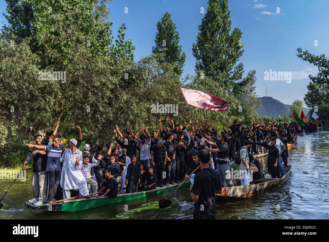 Kashmiri Shiite Muslims shout religious slogans as they participate in ...