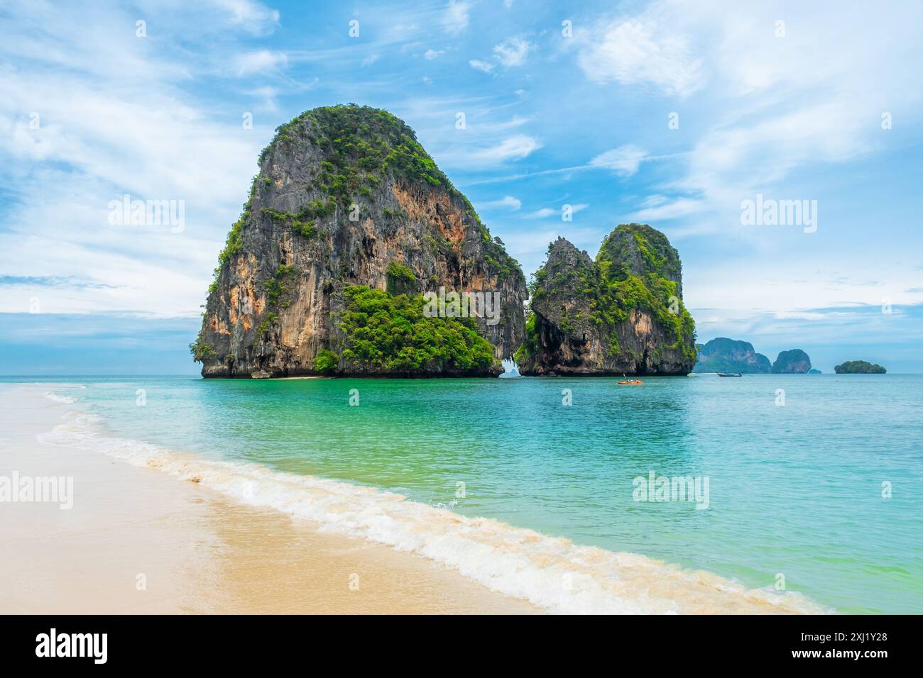 Tropical sandy beach Phra Nang with Ko Rang Nok rocky island with ...