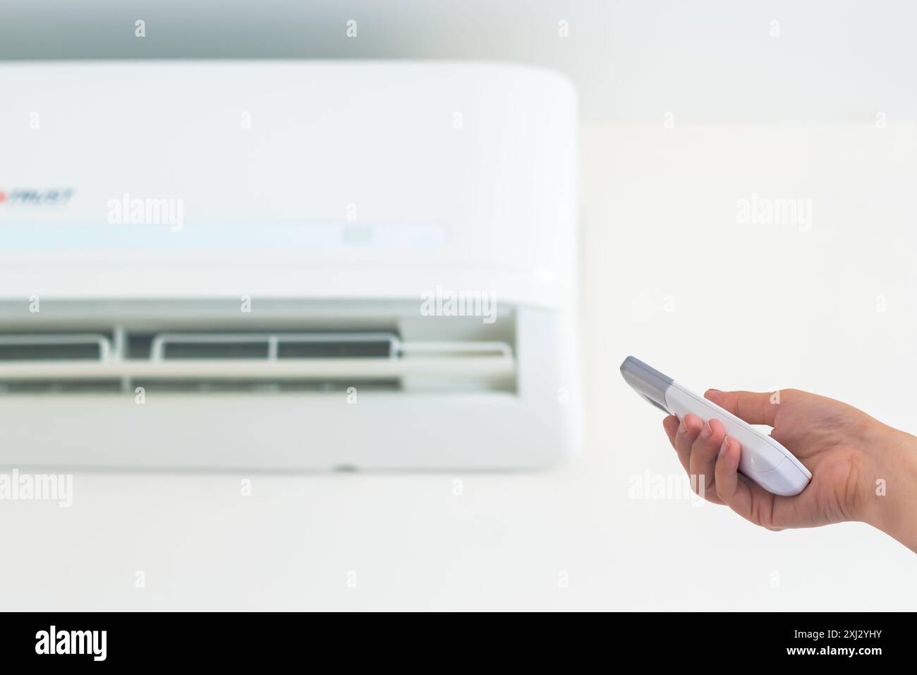 AC wall unit, remote control. Stock Photo