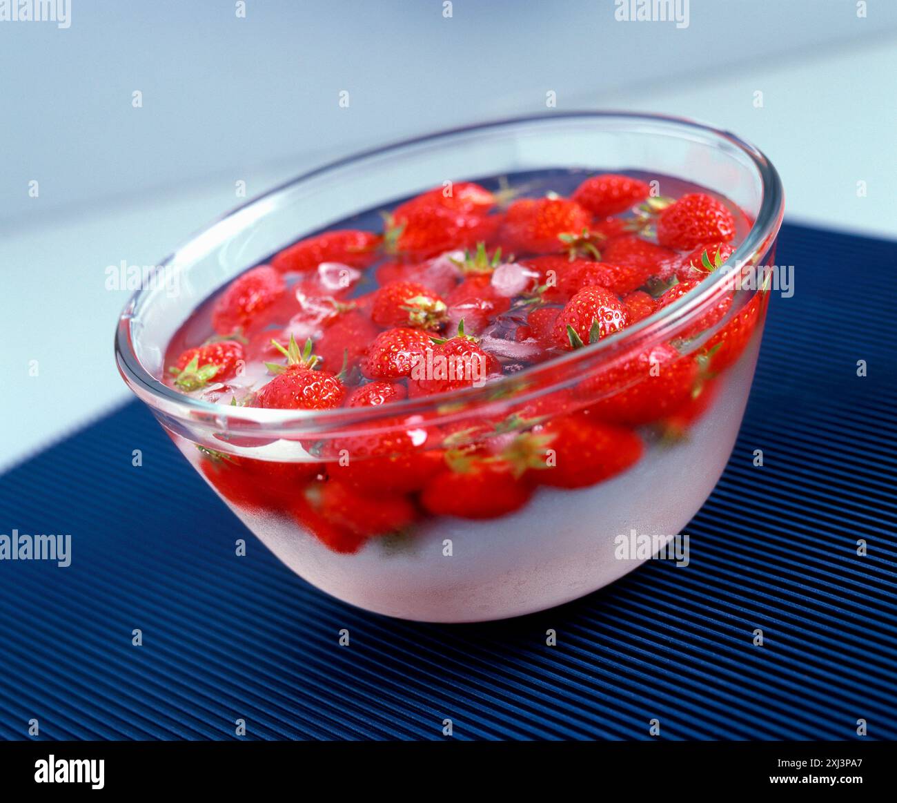 Strawberries in a glass bowl of iced water Stock Photo - Alamy