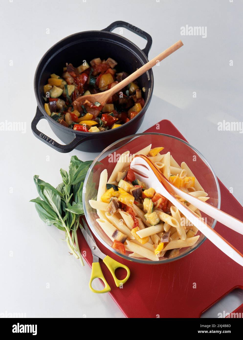 Picture of Adding the vegetables to the pasta Stock Photo - Alamy