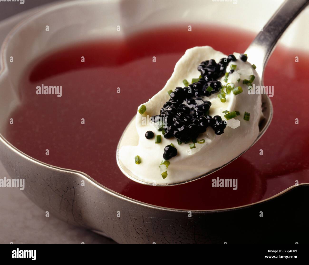 Russian-style Consommé,whipped cream with herring roe Stock Photo - Alamy