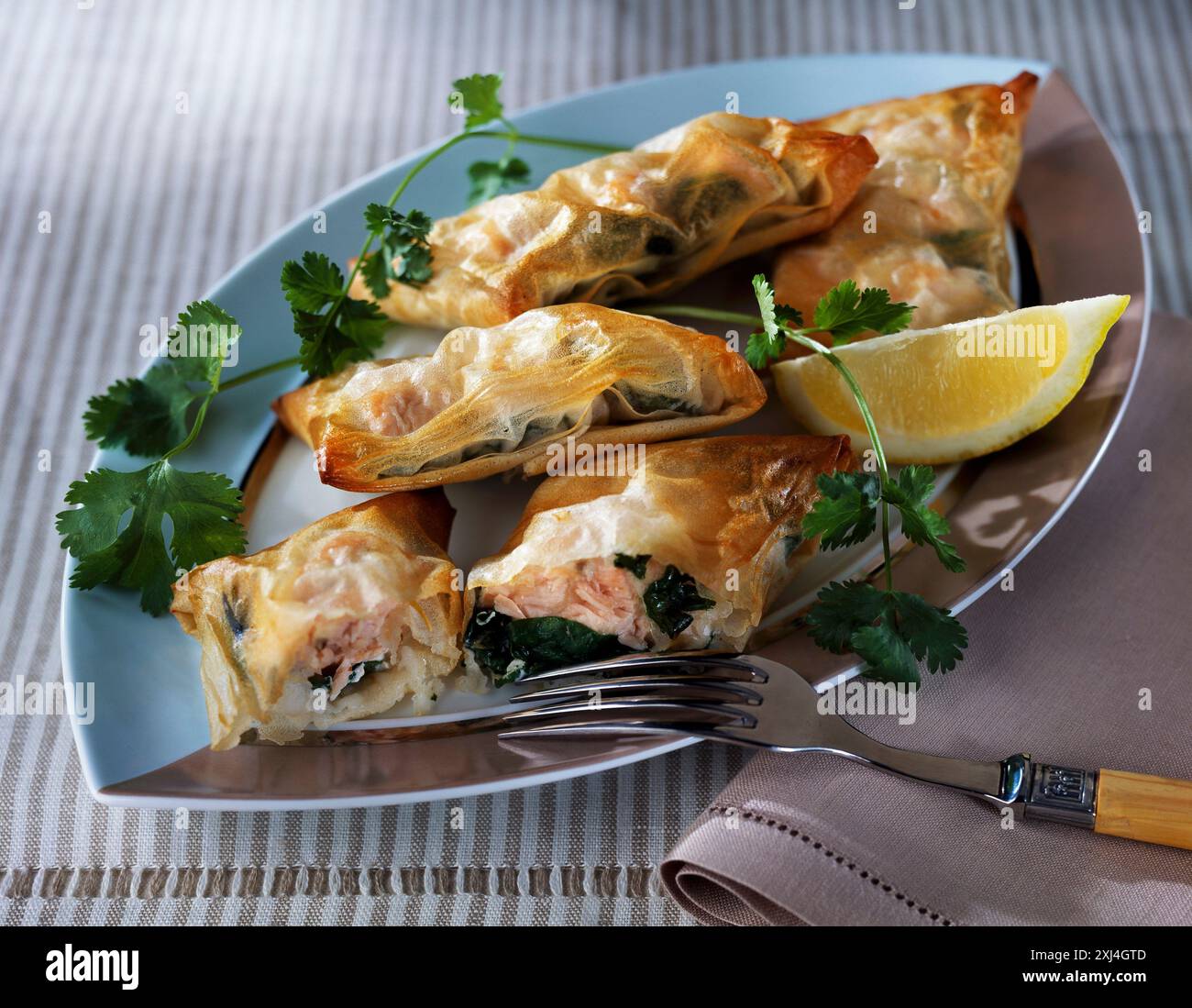 salmon and herb filo pastry pies Stock Photo - Alamy