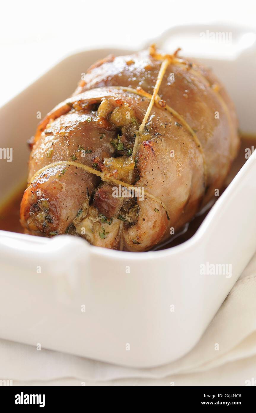 Cook Rabbit Saddle Rabbit saddle stuffed with dates,apples and liver Stock Photo - Alamy