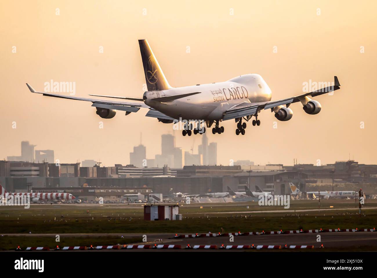 Aircraft shortly in front of landing at Fraport, dawn. Cargo aircraft of the airline Saudi Arabian Airlines, Boeing 747-400F. Frankfurt am Main Stock Photo