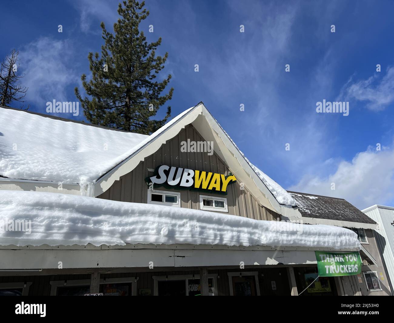 USA. 18th Feb, 2024. Facade of a Subway restaurant in winter with snow