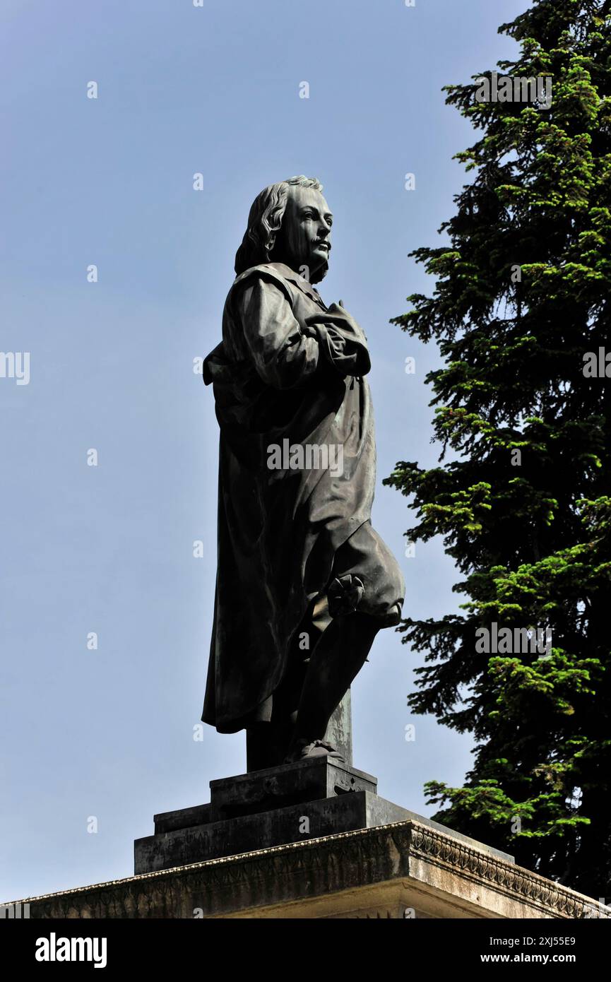 Madrid, Spain, Europe, A bronze statue of a person in a coat in front ...