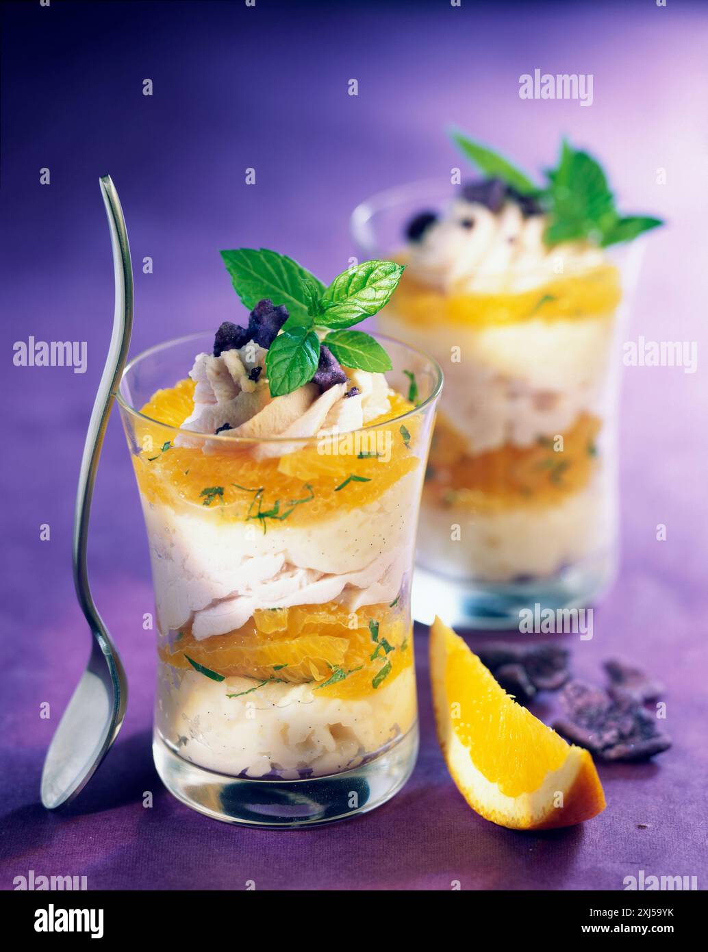Rice pudding with orange and cristallized violets Stock Photo - Alamy