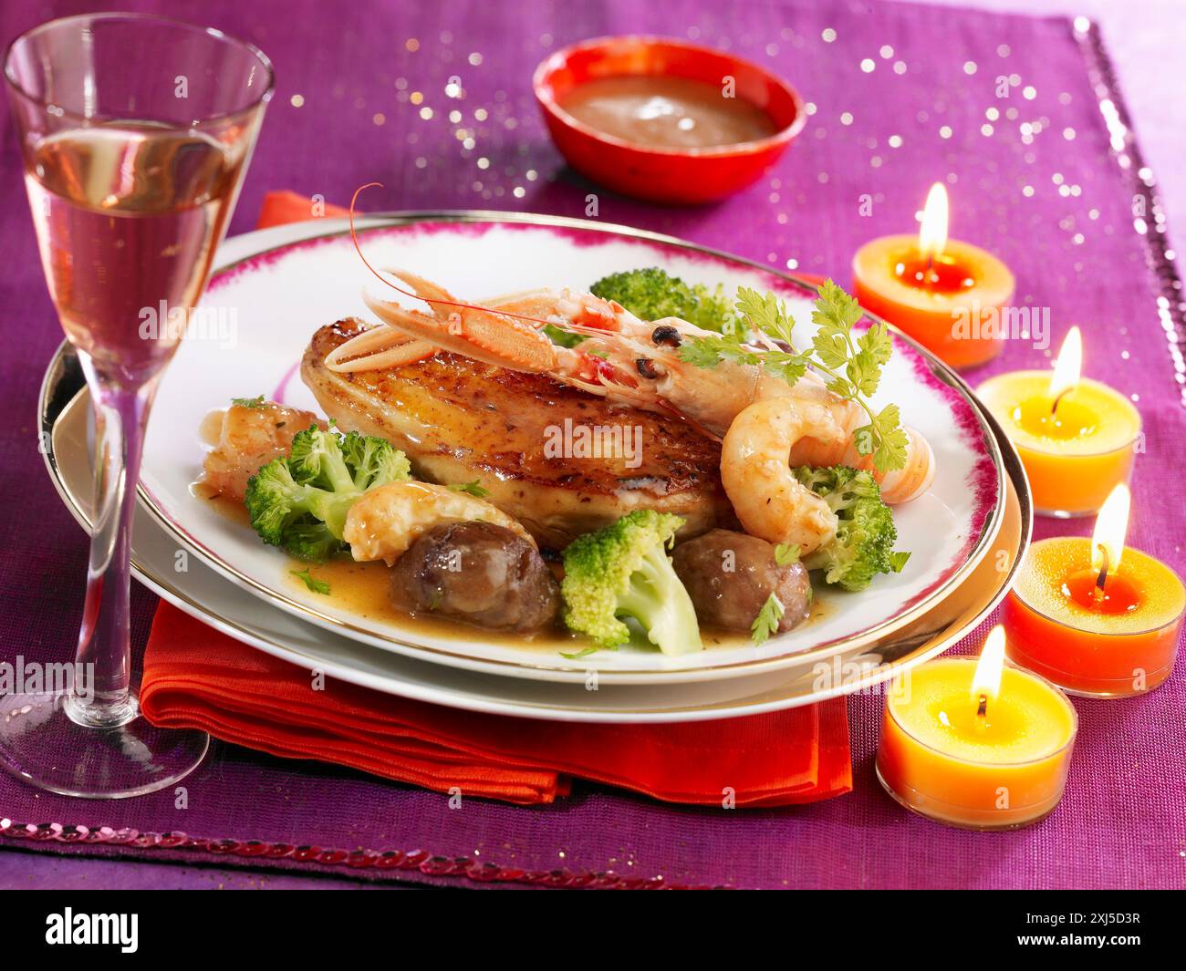 Sauteed guinea-fowl with Dublin Bay prawns Stock Photo - Alamy
