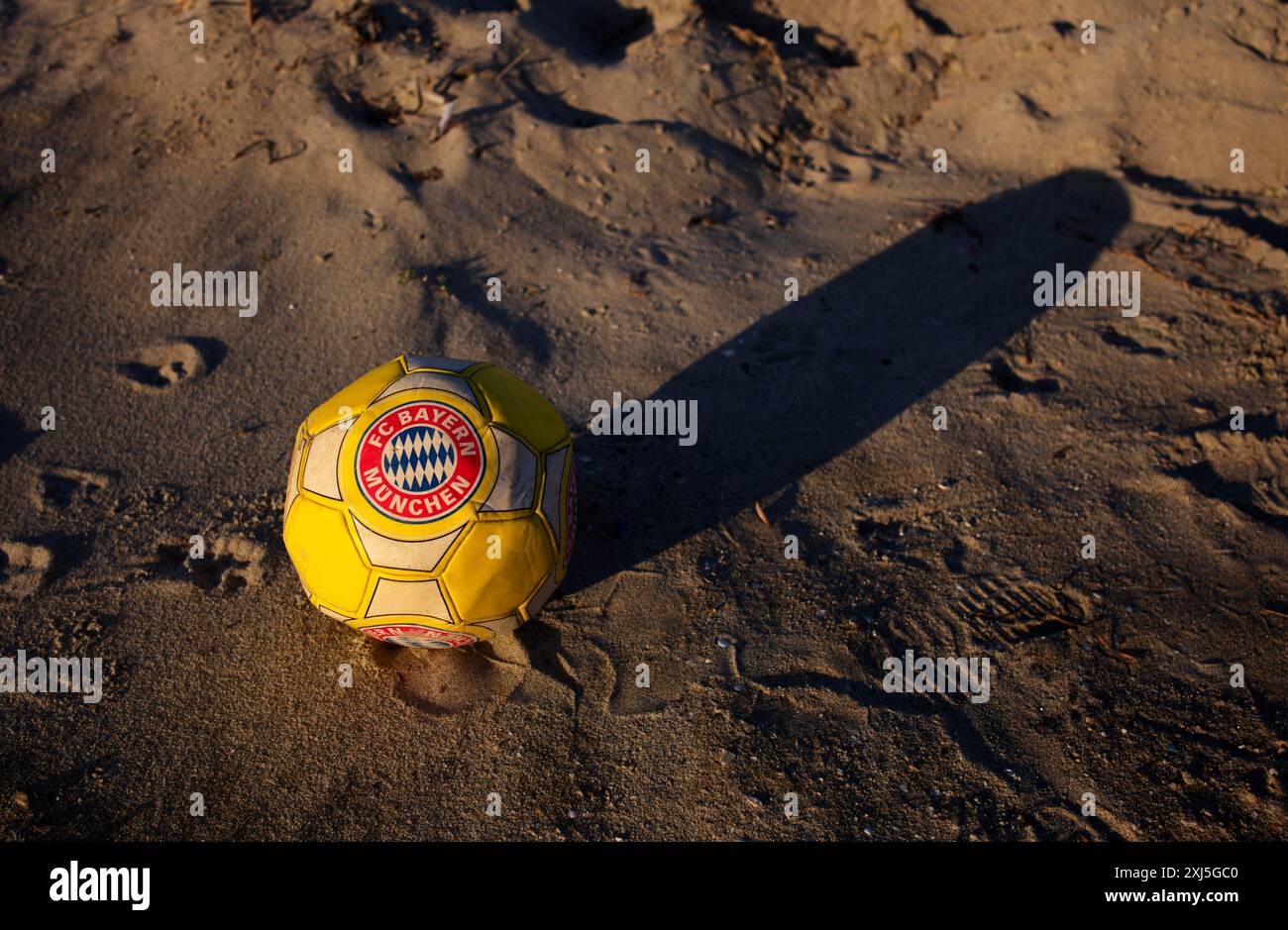 Capped football, leather ball, FC Bayern Munich logo, FCB, air is out, symbolic image, symbolic, Perea, Peraia Beach, Thessaloniki, Macedonia, Greece Stock Photo