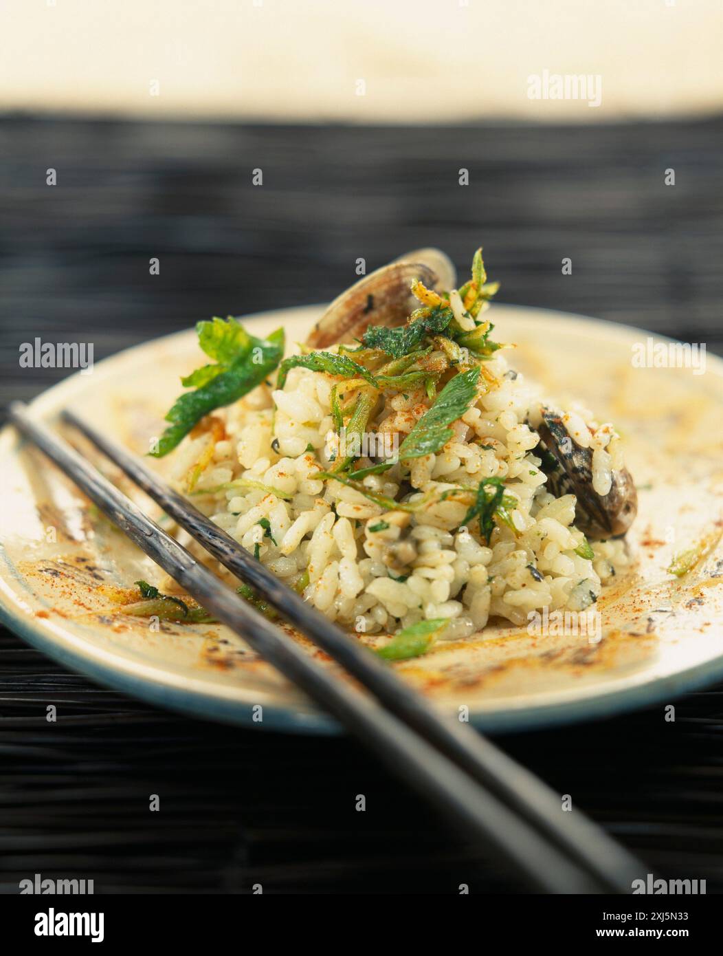 Sauteed rice with littleneck clams and fried parsley Stock Photo - Alamy