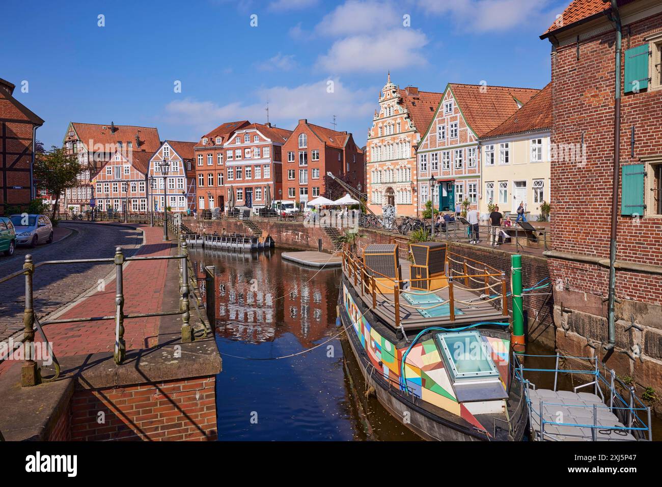 Harbour basin with railings, boats and the gabled houses, brick ...