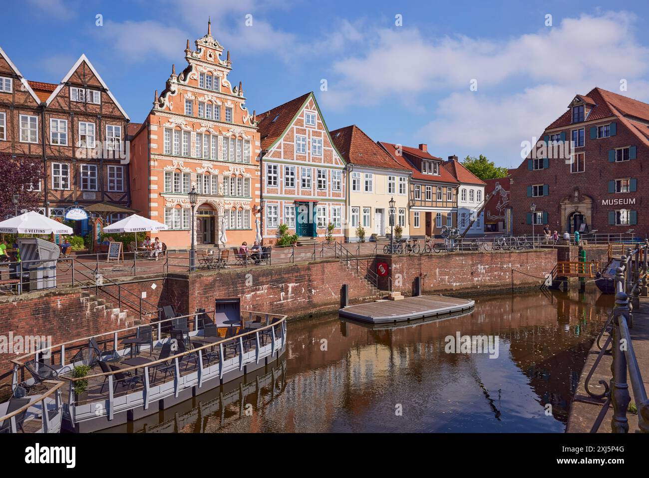 Harbour basin with railings and gabled and old half-timbered houses on ...