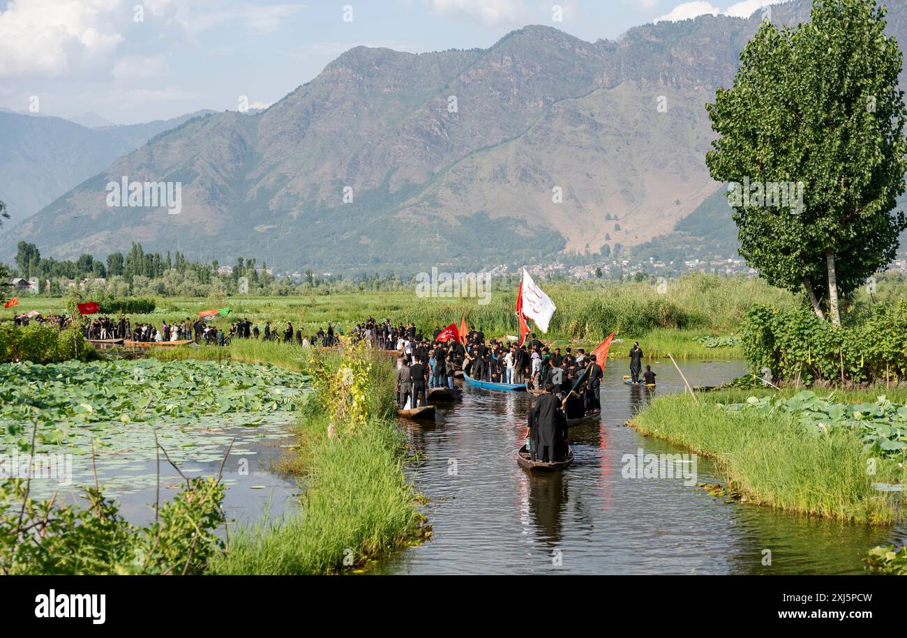 Kashmiri Shia Muslims hold religious flags and shout religious poems ...