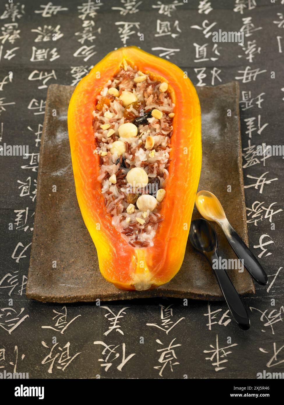Papaya Rice Half a papaya stuffed with wild rice Stock Photo - Alamy