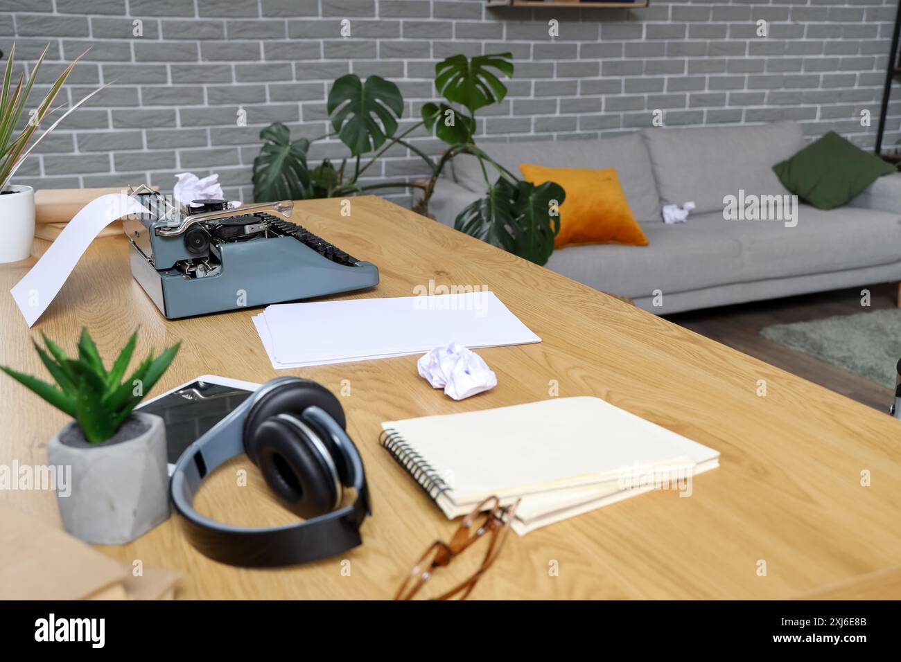 Vintage typewriter with paper sheets on table in author's office Stock Photo