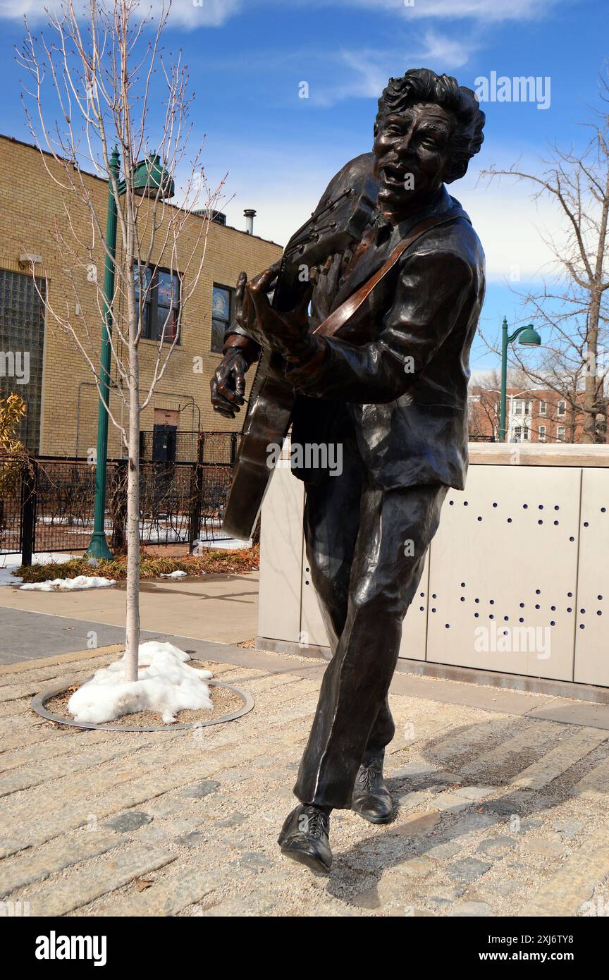 A statue of rocker Chuck Berry, performing his famous duck walk, stands ...