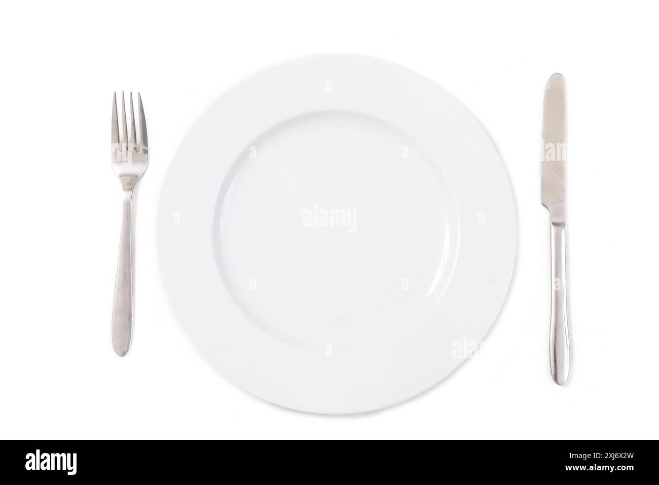 Knife,fork and plate on a white background Stock Photo - Alamy