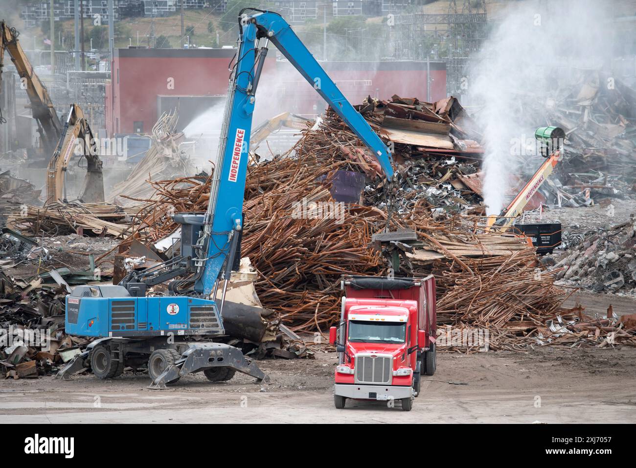 Demolition crews process and remove tons  of materials from the decommissioned coal burning power plant in downtown Colorado Springs, Colorado. Stock Photo